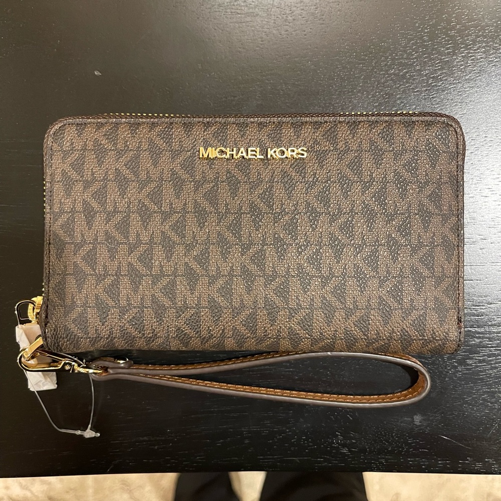Brand New Michael Kors wrist wallet.
